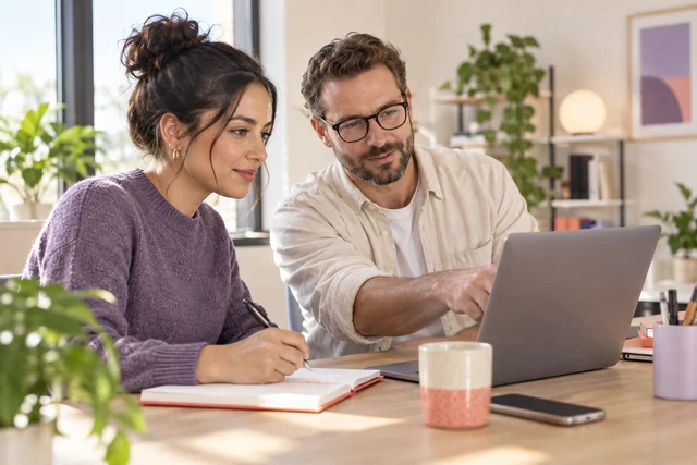 Colleagues checking timesheet information before payroll preparation